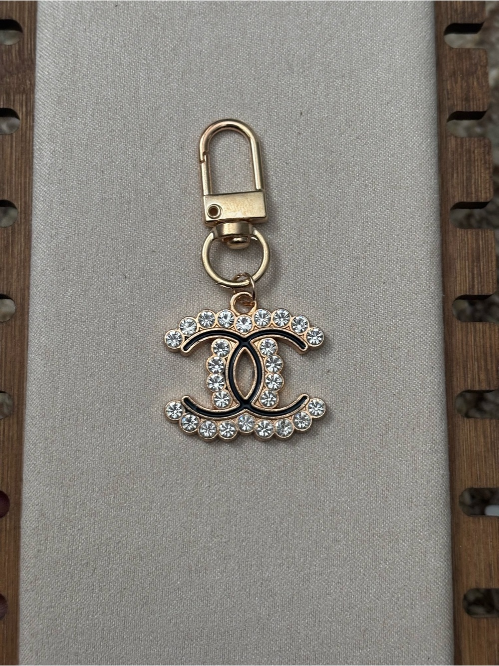 Gold Crystal Interlocked Logo zip tag Charm